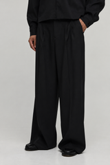 Wide Leg Pleated Tailored Trousers — Black